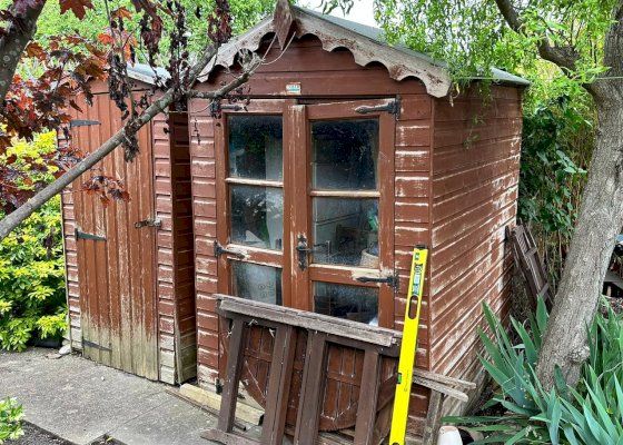 Old building being dismantled - roof removed, walls to follow