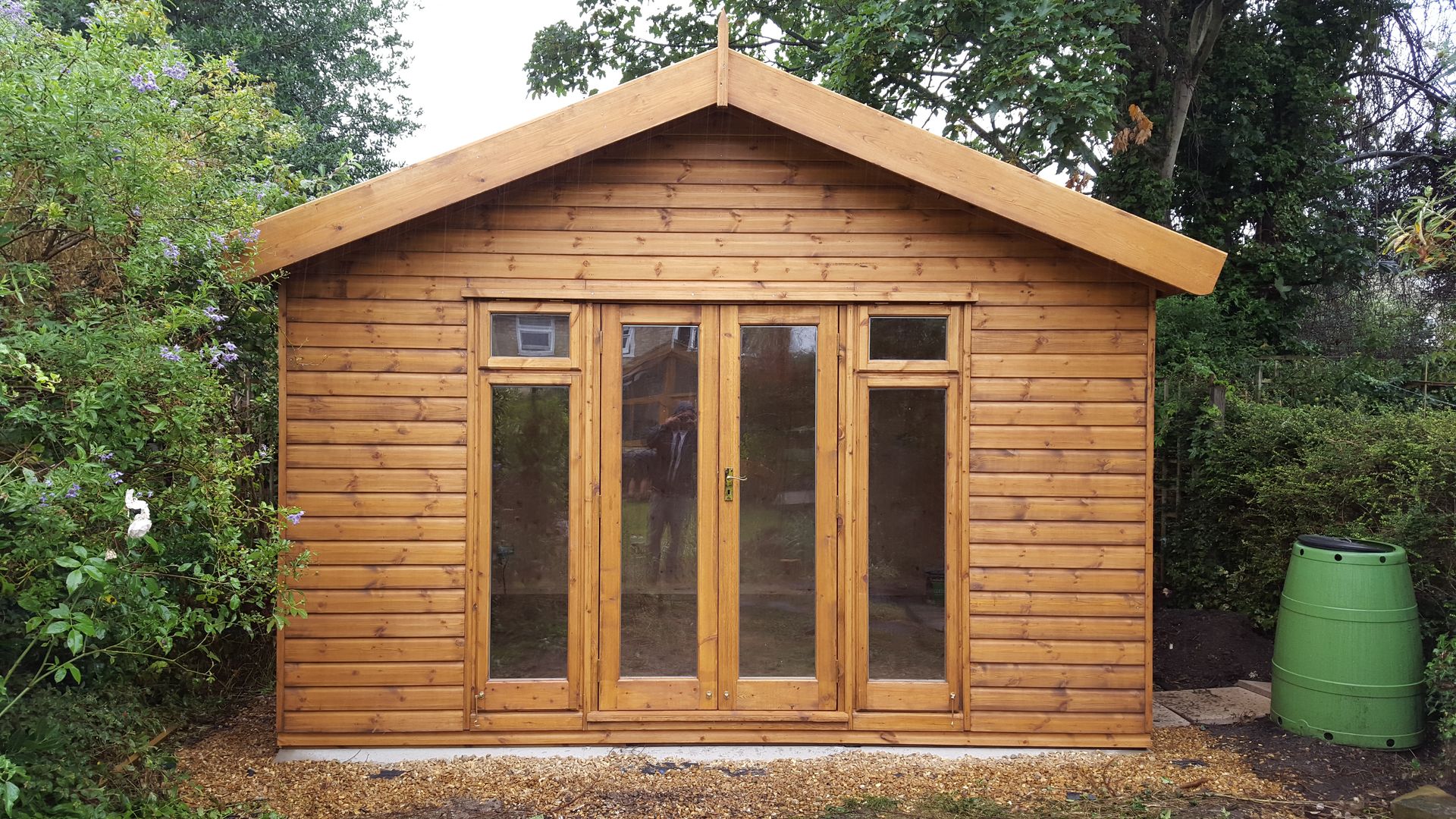A garden building set up as a TV and games room