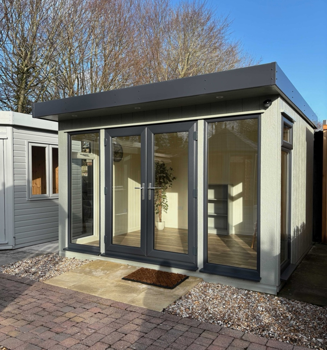 Cambridge Studio Plus 12ft x 10ft (3.6m x 3.0m) showing painted lining, electrics and vinyl tile flooring.