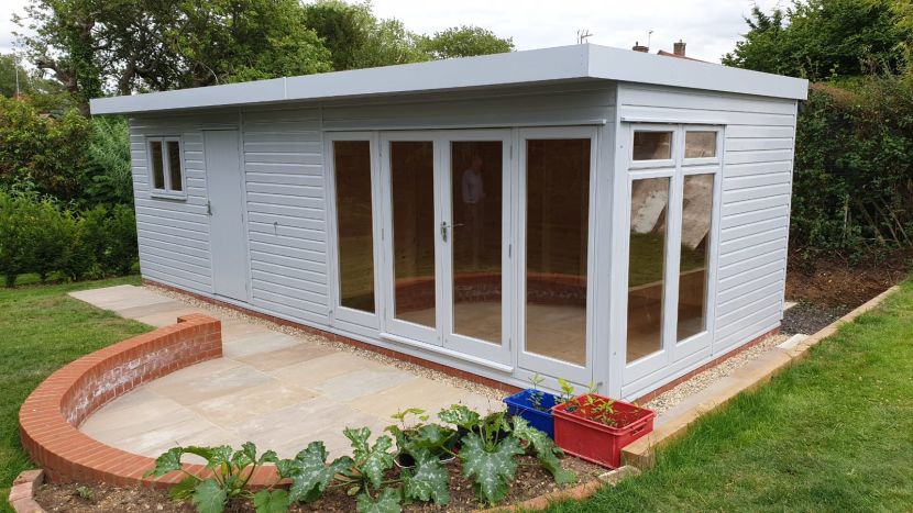 Cambridge Garden Studio 26ft x 11ft (7.8m x 3.3m) with integral shed in an opaque stain finish