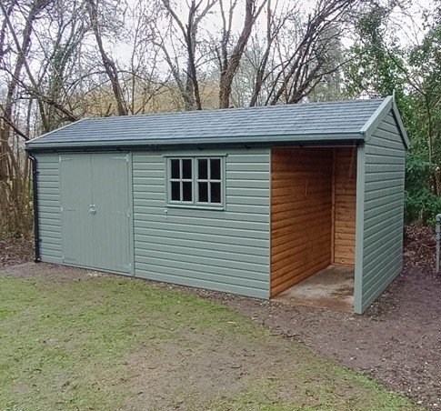 Craftsman 16ft x 8ft (4.8m x 2.4m) with 4ft (1.2m) open store, grey felt tiles, paint finish, double door & joinery window.