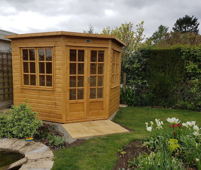 8ft x 8ft (2.4m x 2.4m). Georgian windows. Sadolin finish