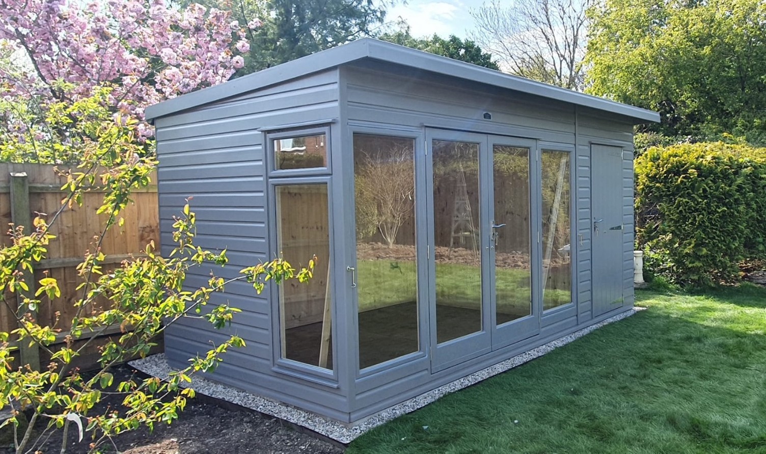 Ely Garden Room 10ft x 8ft (3.0m x 2.4m) with 4ft (1.2m) optional shed section, side window with top opening vent and exterior paint finish. Insulated and then lined with tongue & groove boards inside.