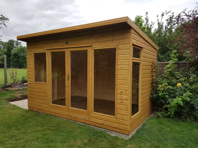 With top opening side window, Sadolin finish, small front window for desk