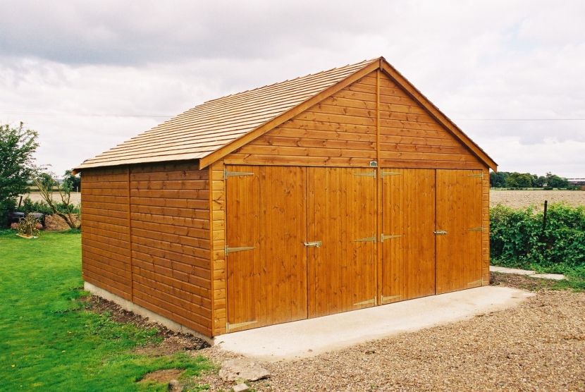 Classic double garage with cedar shingle roof